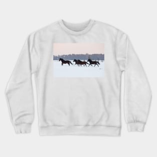 Four horses galloping on snowy paddock Crewneck Sweatshirt